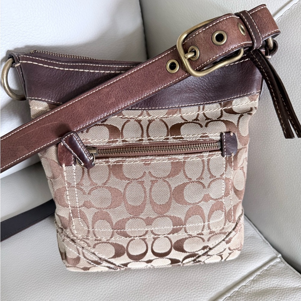 Coach leather/canvas Soho vintage Crossbody Bag. In signature jaguar.